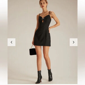 The Black V Neck Cutout  Sleeveless Mini Dress size med LBD sexy rhinestone bow